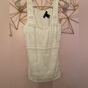 White House Black Market. XS beaded top. Stain on bottom - prob come out in wash